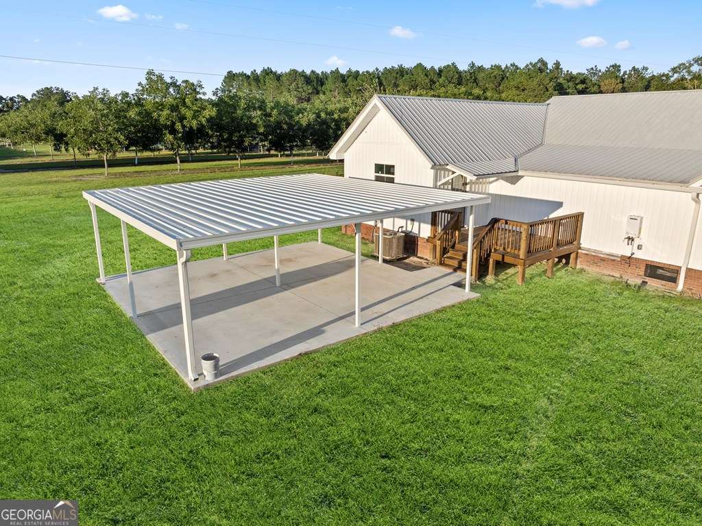 1335 Clifford Loop Blackshear, GA 31516 - Photo 8 of 43 an aerial view of a house with swimming pool and a yard