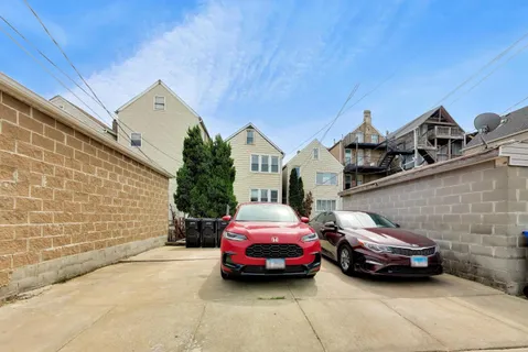a front view of a house with parking space