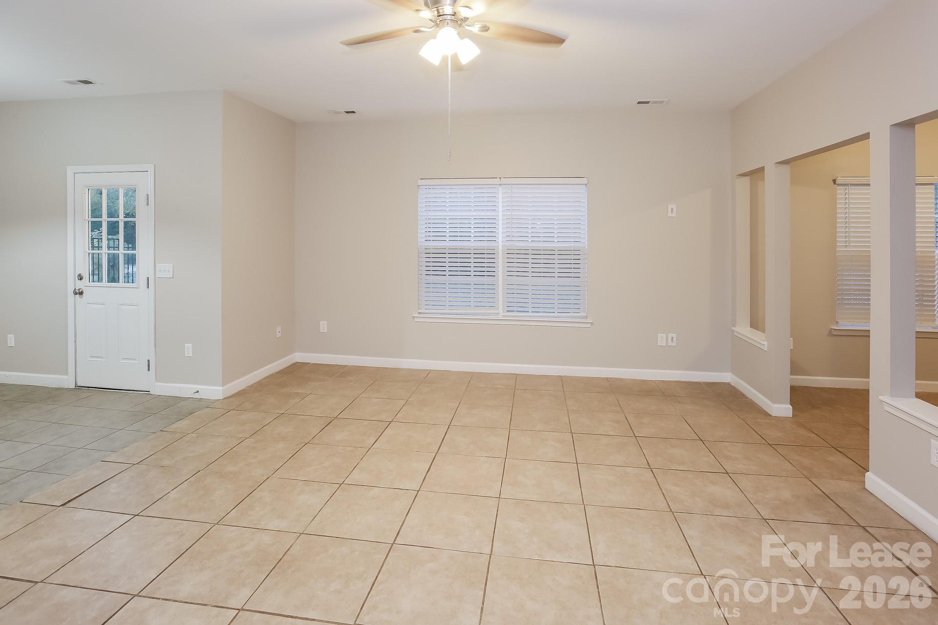 8812 Cornwall Street Locust, NC 28097 - Photo 7 of 15 a view of an empty room with a window