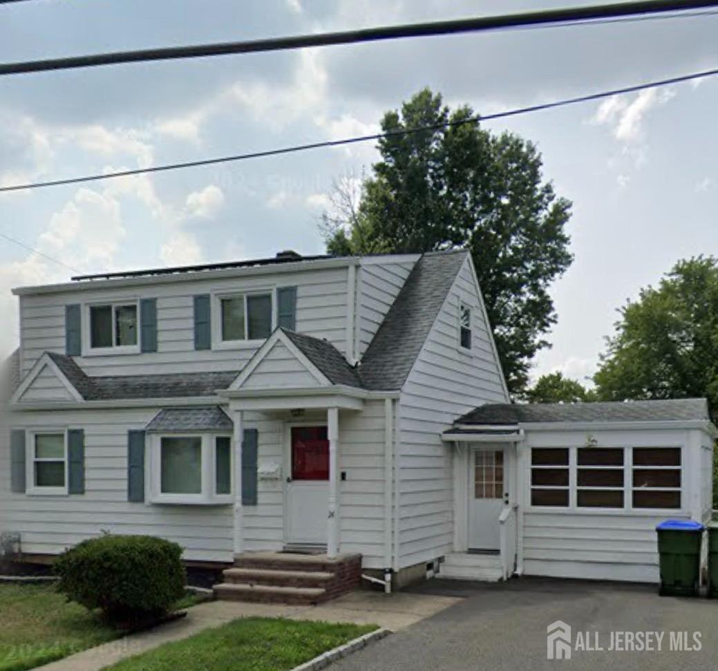 24 Morgan Drive Edison, NJ 08817 - Photo 1 of 1 a front view of a house with a yard and garage