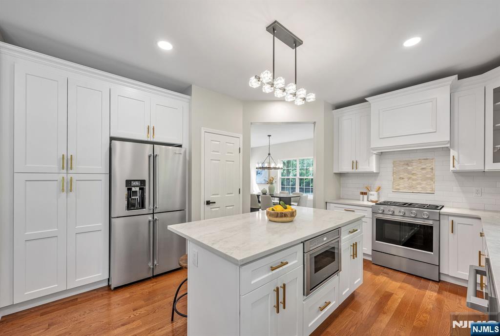1 Winding Ridge Road Lake Hopatcong, NJ 07849 - Photo 11 of 50 a kitchen with stainless steel appliances a stove a refrigerator a sink and a center island