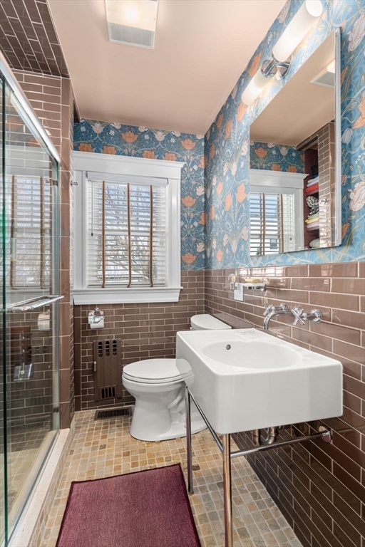 23 Newman Way, Unit 1 Arlington, MA 02476 - Photo 18 of 28 a bathroom with a sink a toilet and shower