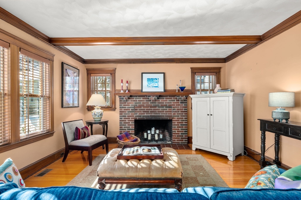 23 Newman Way, Unit 1 Arlington, MA 02476 - Photo 2 of 28 a living room with furniture and a fireplace