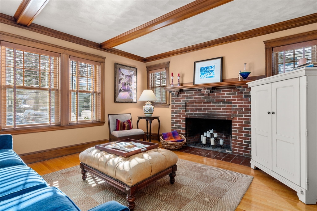 23 Newman Way, Unit 1 Arlington, MA 02476 - Photo 3 of 28 a living room with furniture and a fireplace