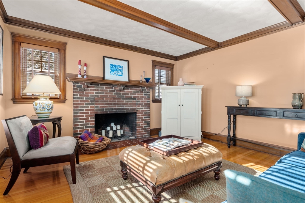 23 Newman Way, Unit 1 Arlington, MA 02476 - Photo 4 of 28 a living room with furniture fireplace and a table