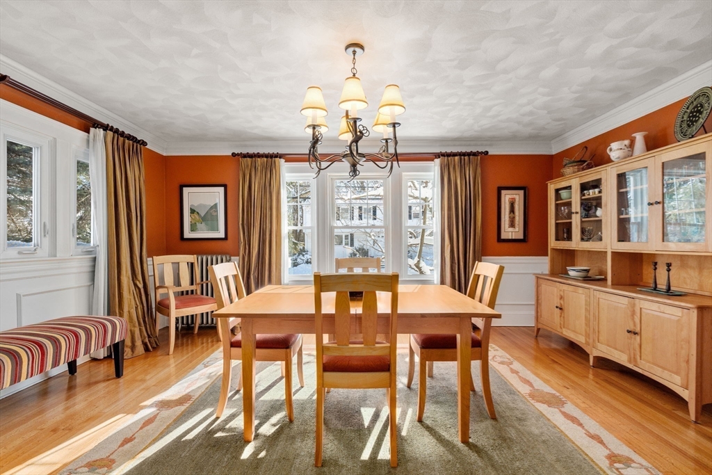 23 Newman Way, Unit 1 Arlington, MA 02476 - Photo 6 of 28 a view of a dining room with furniture window and wooden floor
