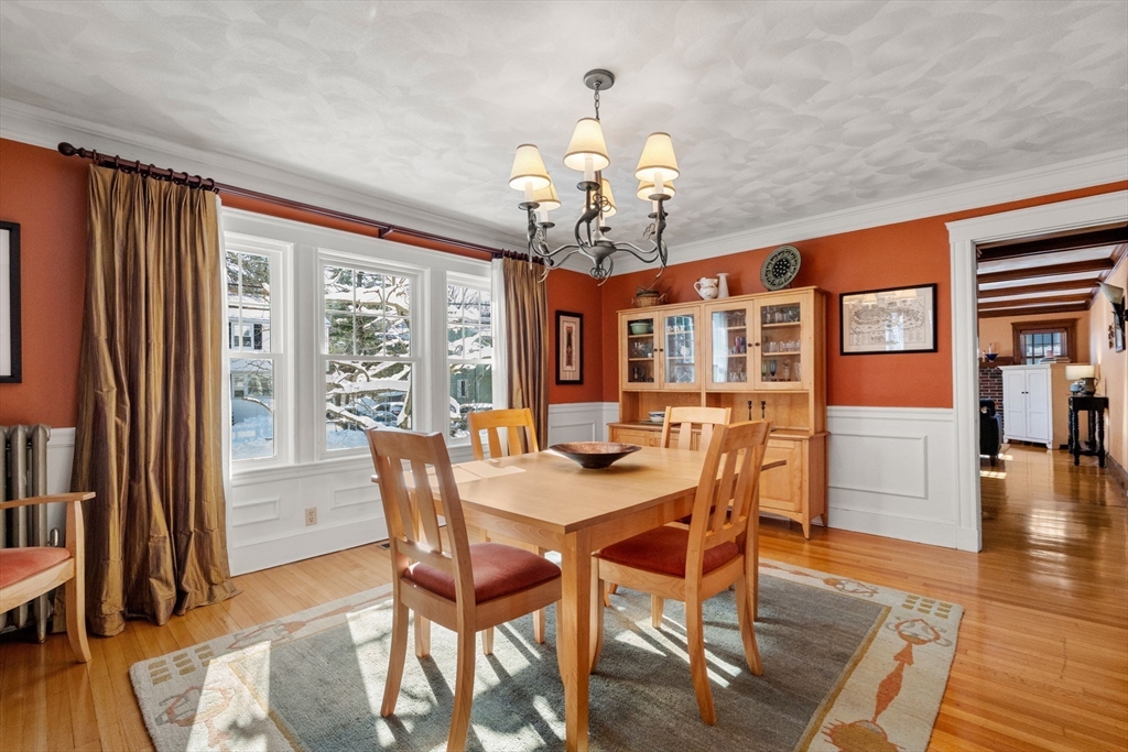 23 Newman Way, Unit 1 Arlington, MA 02476 - Photo 8 of 28 a view of a dining room with furniture window and wooden floor