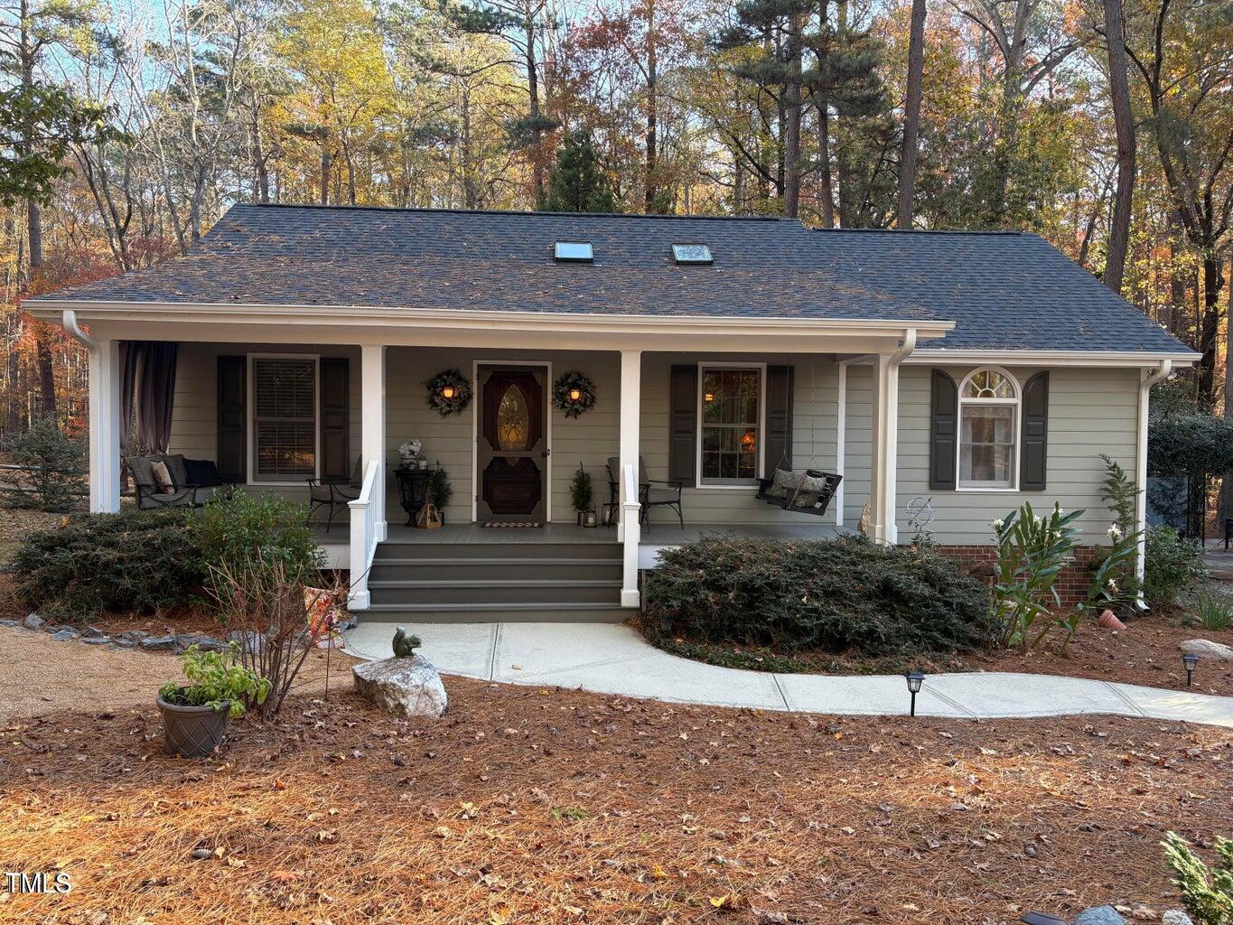 5313 Pine Drive Raleigh, NC 27606 - Photo 1 of 34 a front view of a house with garden