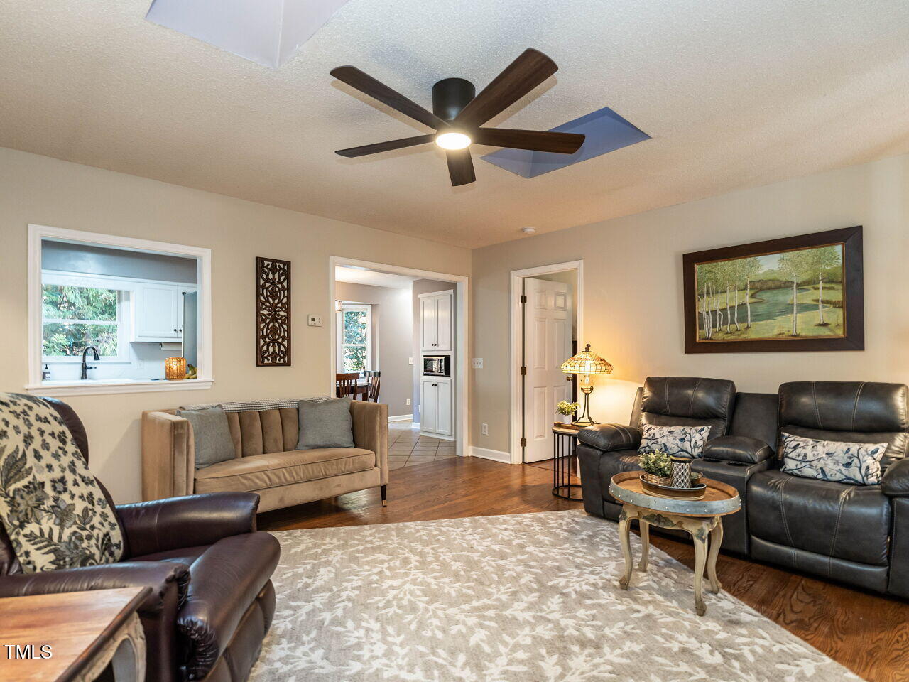 5313 Pine Drive Raleigh, NC 27606 - Photo 11 of 34 a living room with furniture and a large window