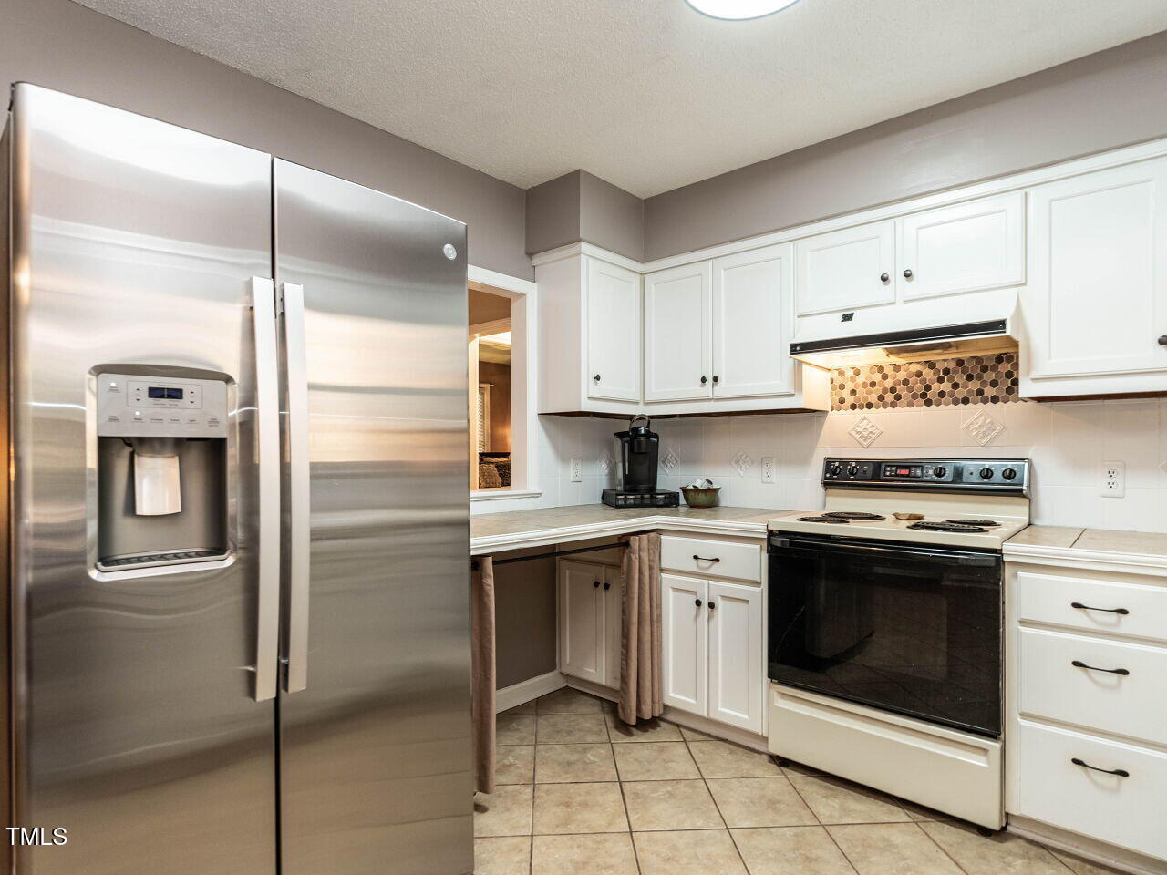 5313 Pine Drive Raleigh, NC 27606 - Photo 17 of 34 a kitchen with a stove sink and refrigerator