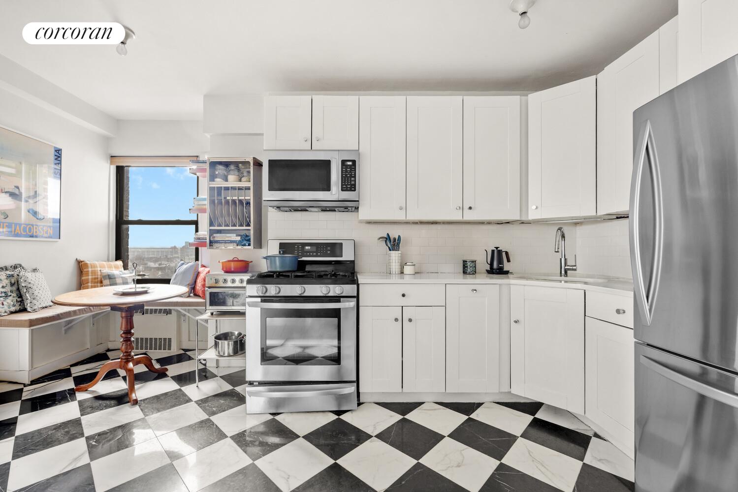 303 Beverley Road, Unit 8D Brooklyn, NY 11218 - Photo 4 of 9 a kitchen with a stove a sink and a refrigerator