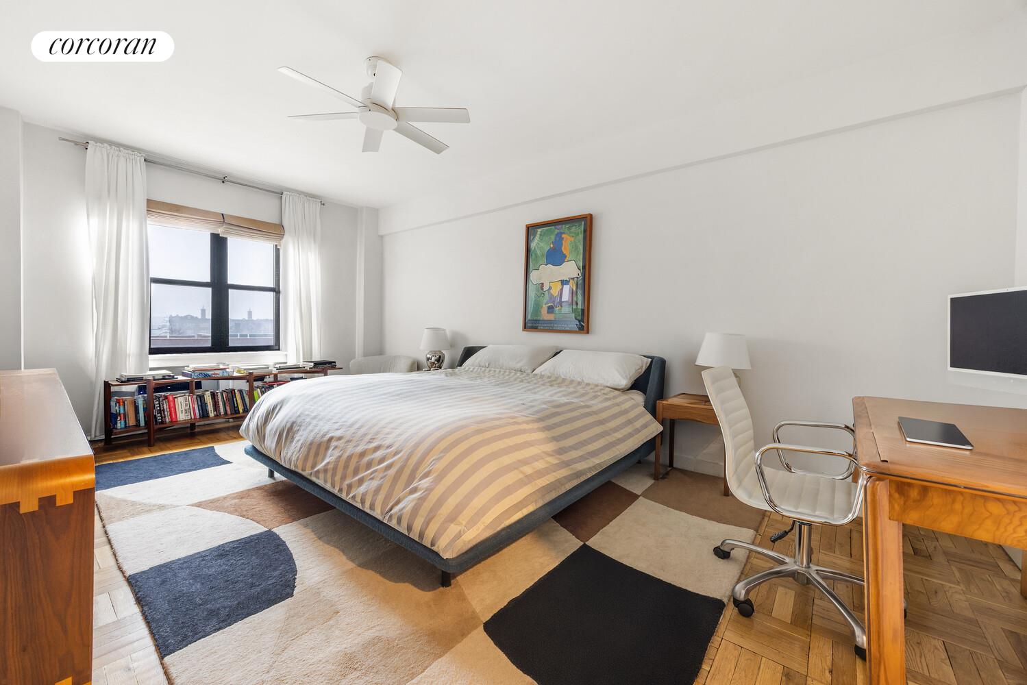 303 Beverley Road, Unit 8D Brooklyn, NY 11218 - Photo 5 of 9 a spacious bedroom with a bed a couch and a window