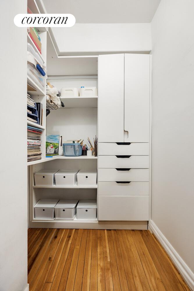 303 Beverley Road, Unit 8D Brooklyn, NY 11218 - Photo 8 of 9 a view of walk in closet with empty racks