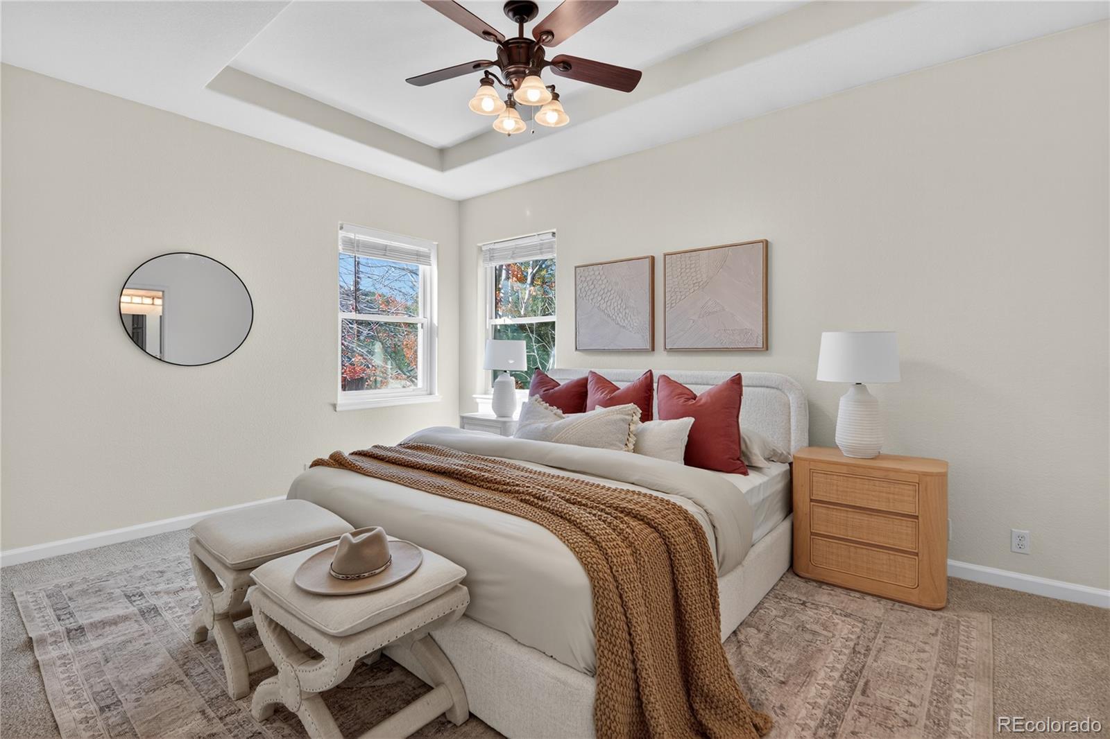 665 Kilmer Street Golden, CO 80401 - Photo 23 of 35 a bedroom with a bed and a chandelier