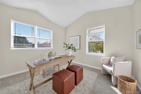 a living room with furniture and windows