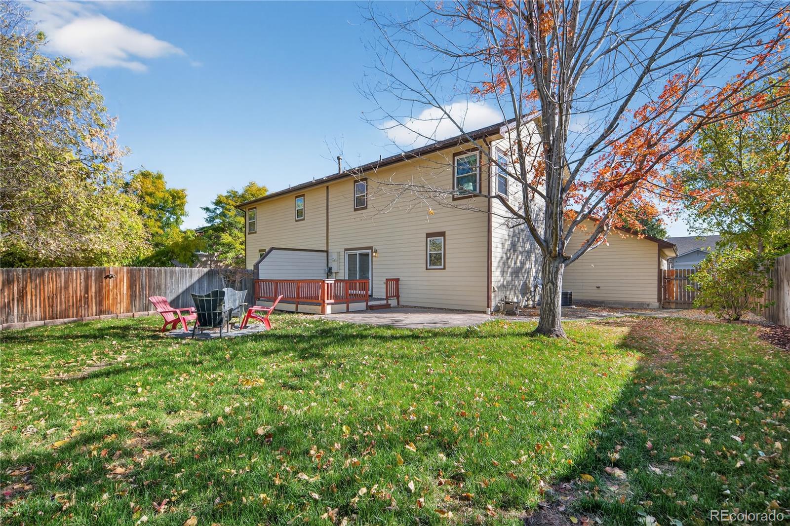 665 Kilmer Street Golden, CO 80401 - Photo 33 of 35 a view of a house with backyard and a tree