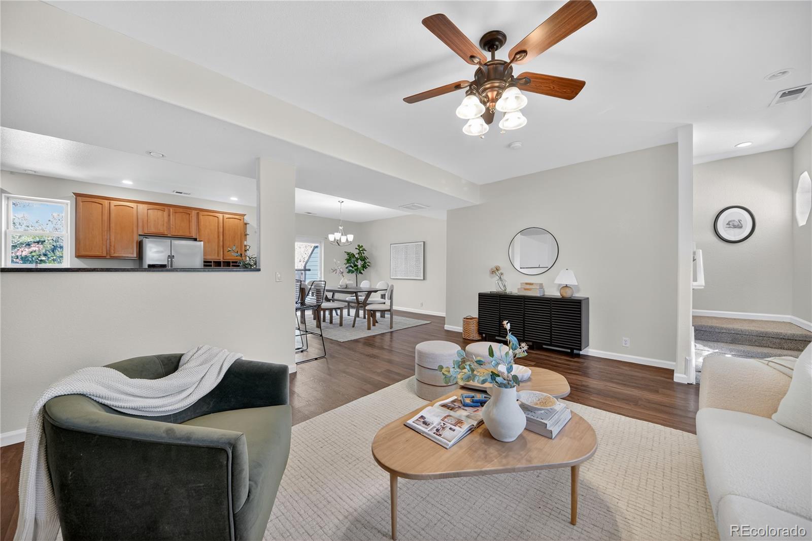 665 Kilmer Street Golden, CO 80401 - Photo 9 of 35 a living room with furniture chandelier and a view of kitchen