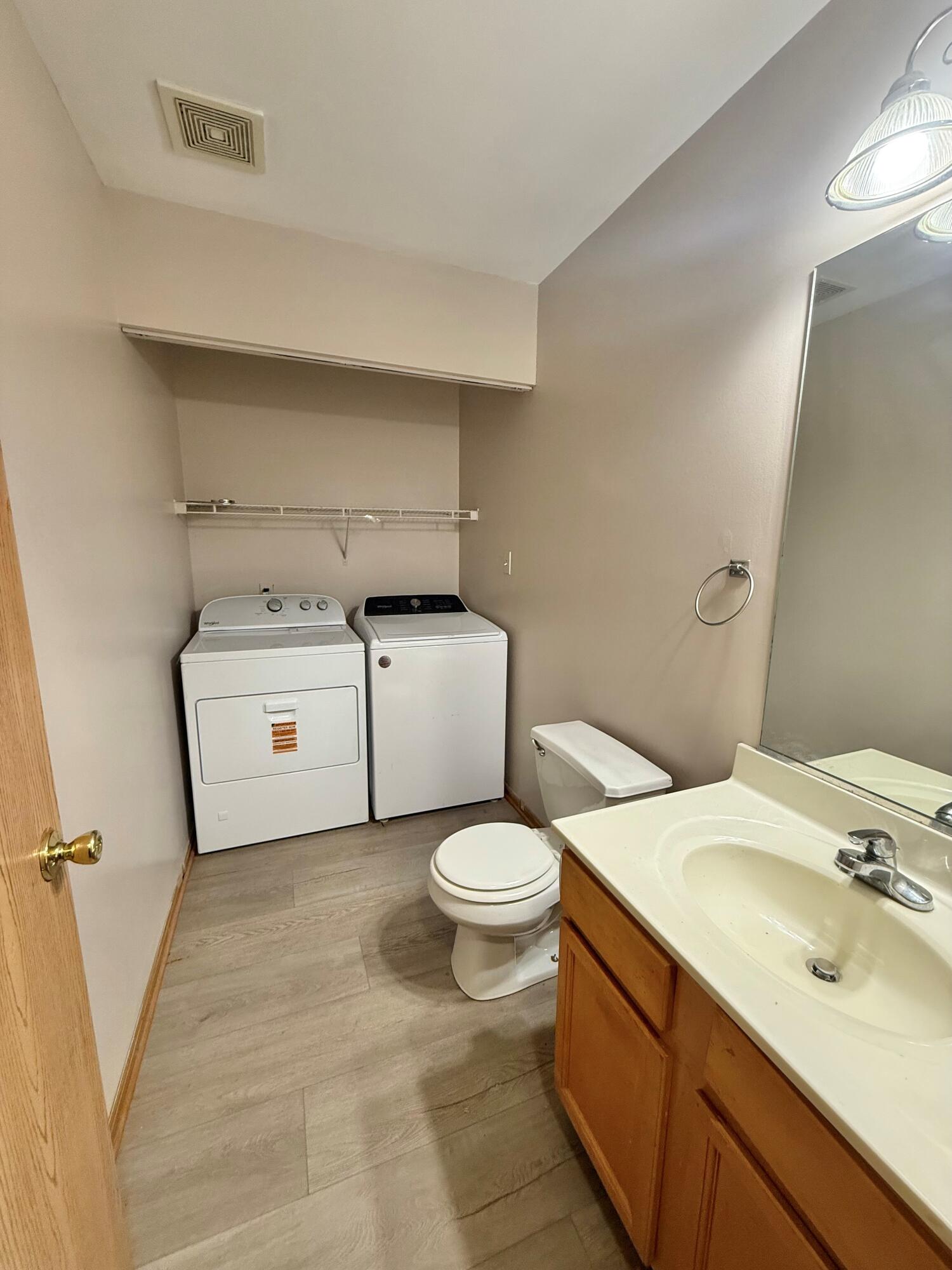 395 Plymouth Road, Unit B Valparaiso, IN 46385 - Photo 8 of 8 a white toilet sitting next to a bathroom sink