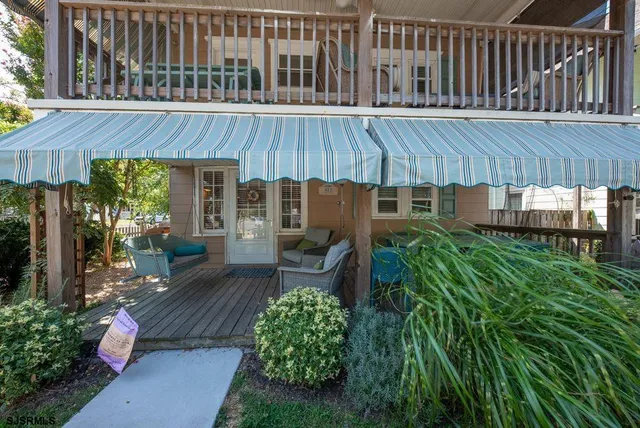 a view of a backyard with sitting area