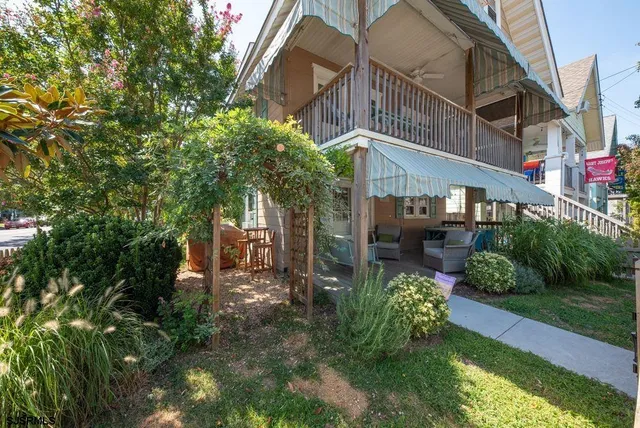 a view of a building with a yard