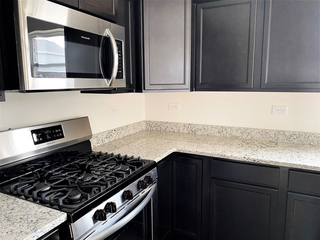 2019 Stapleton Road New Lenox, IL 60451 - Photo 5 of 17 a kitchen with a stove and a microwave