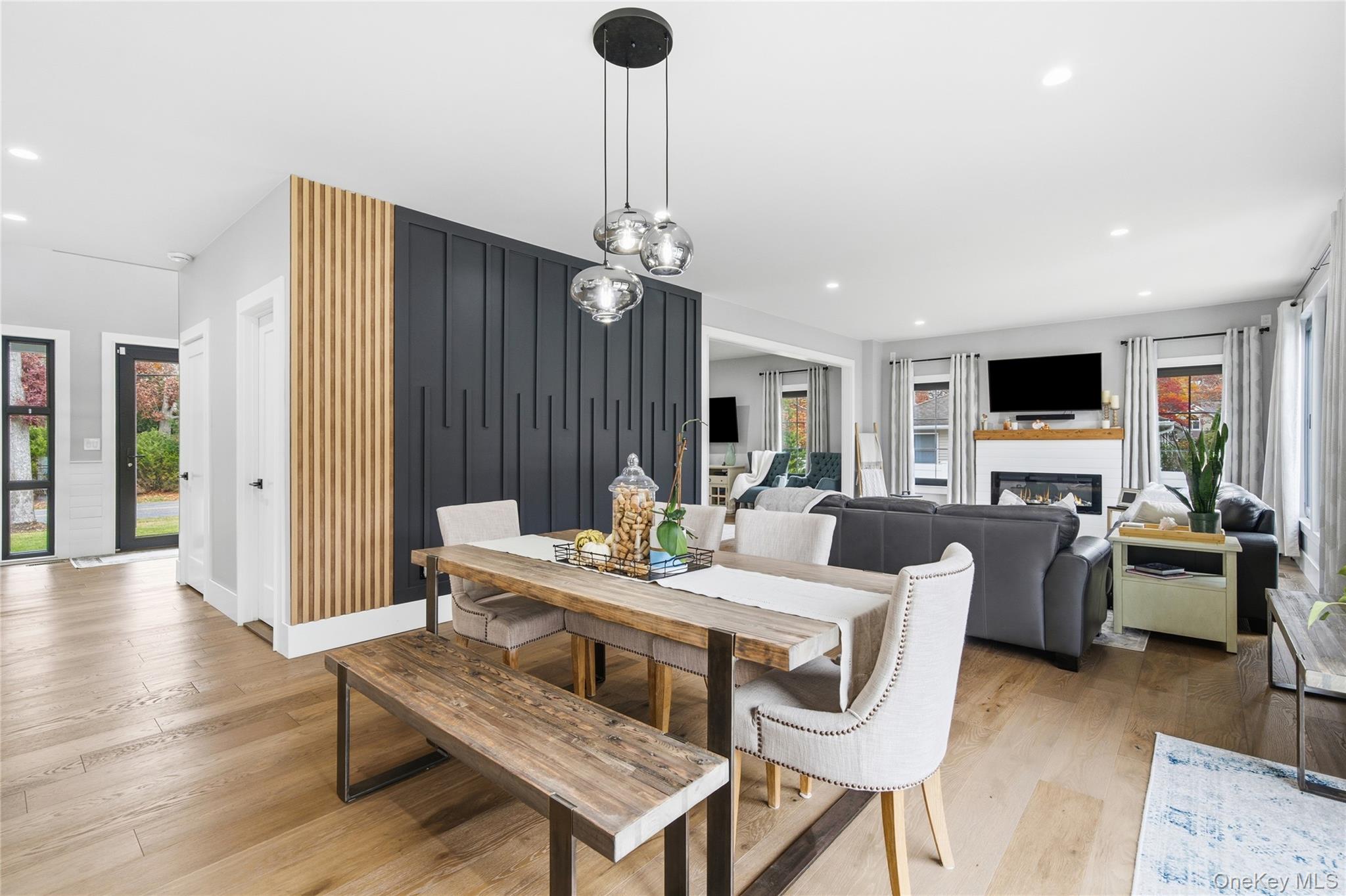 18 Timber Point Road East Islip, NY 11730 - Photo 11 of 34 a living room with furniture a fireplace and a flat screen tv