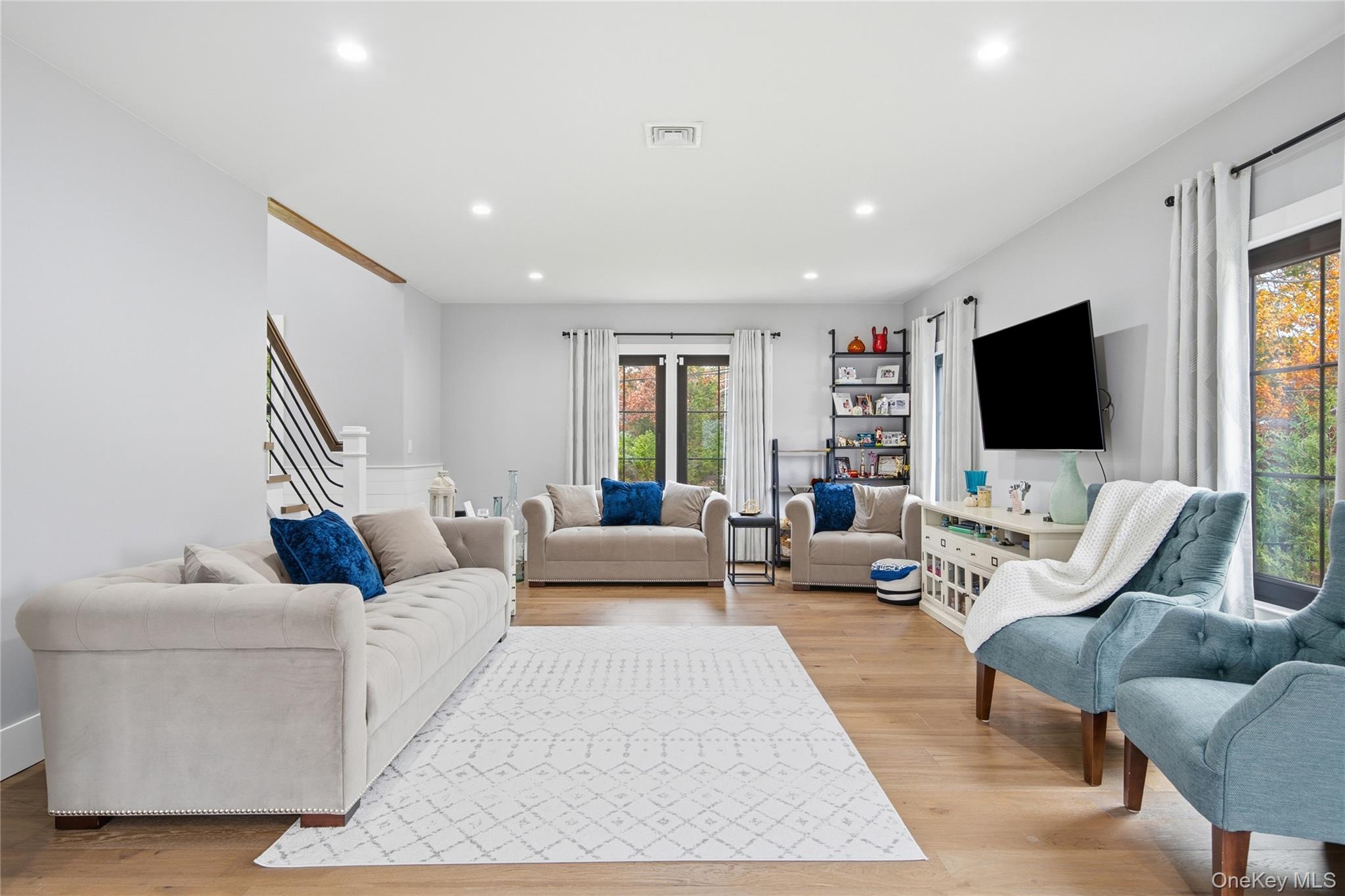 18 Timber Point Road East Islip, NY 11730 - Photo 15 of 34 a living room with furniture and a flat screen tv