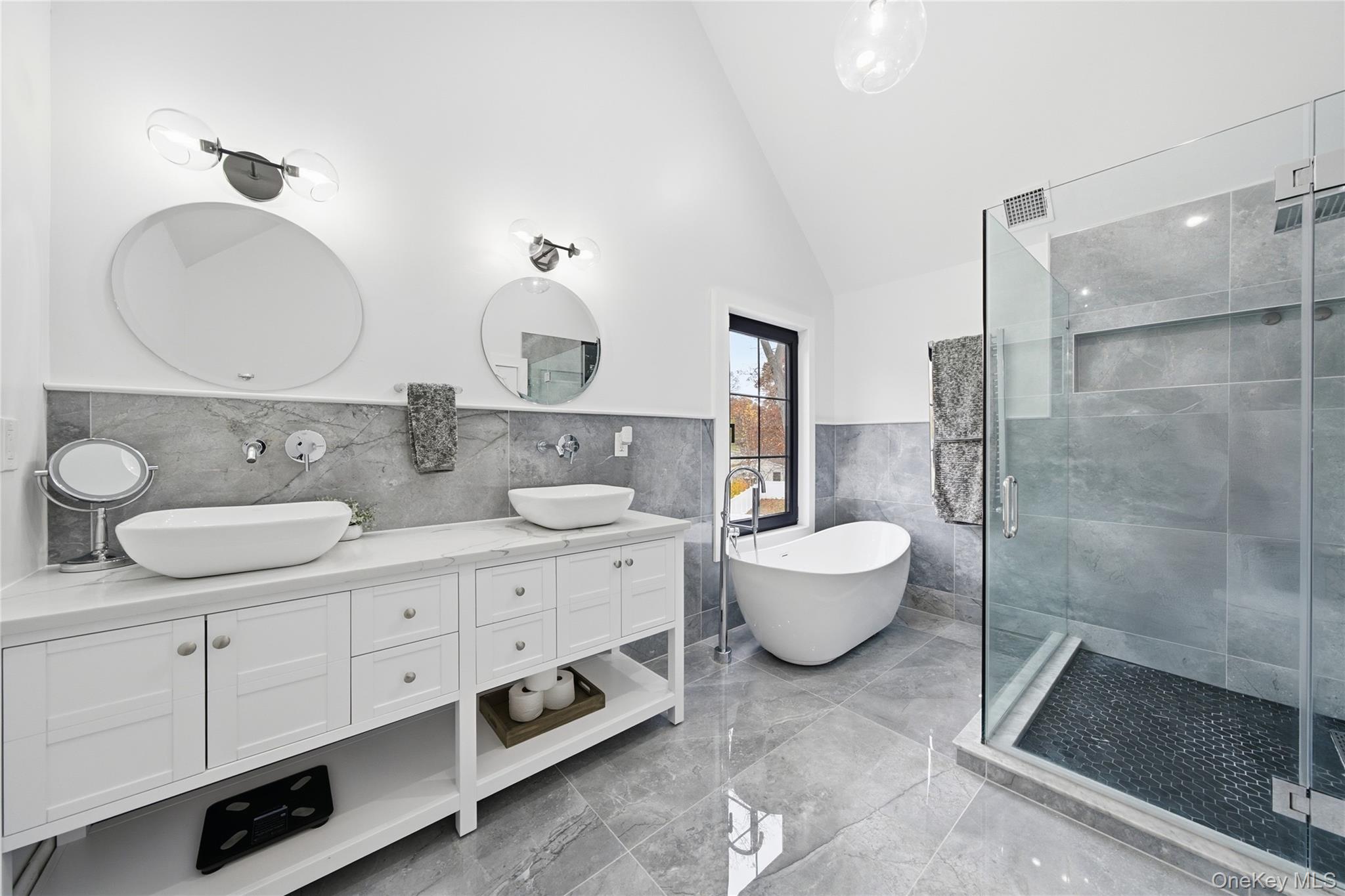 18 Timber Point Road East Islip, NY 11730 - Photo 19 of 34 a bathroom with a double vanity sink mirror and toilet