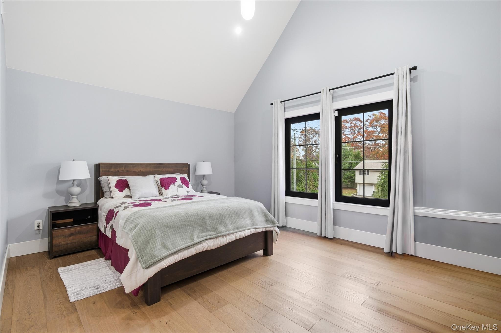 18 Timber Point Road East Islip, NY 11730 - Photo 23 of 34 a bedroom with a large bed and a large window