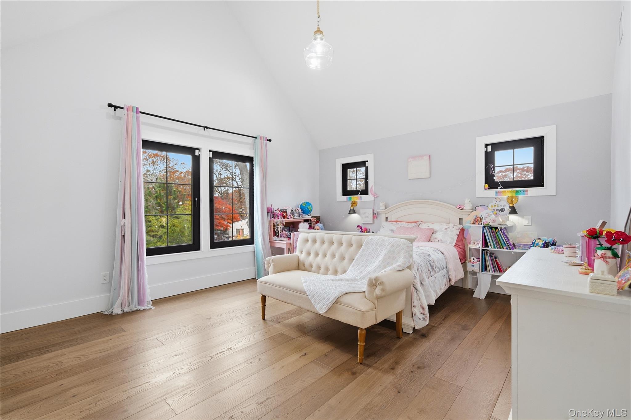 18 Timber Point Road East Islip, NY 11730 - Photo 24 of 34 a bed room with a bed window and a wooden floor