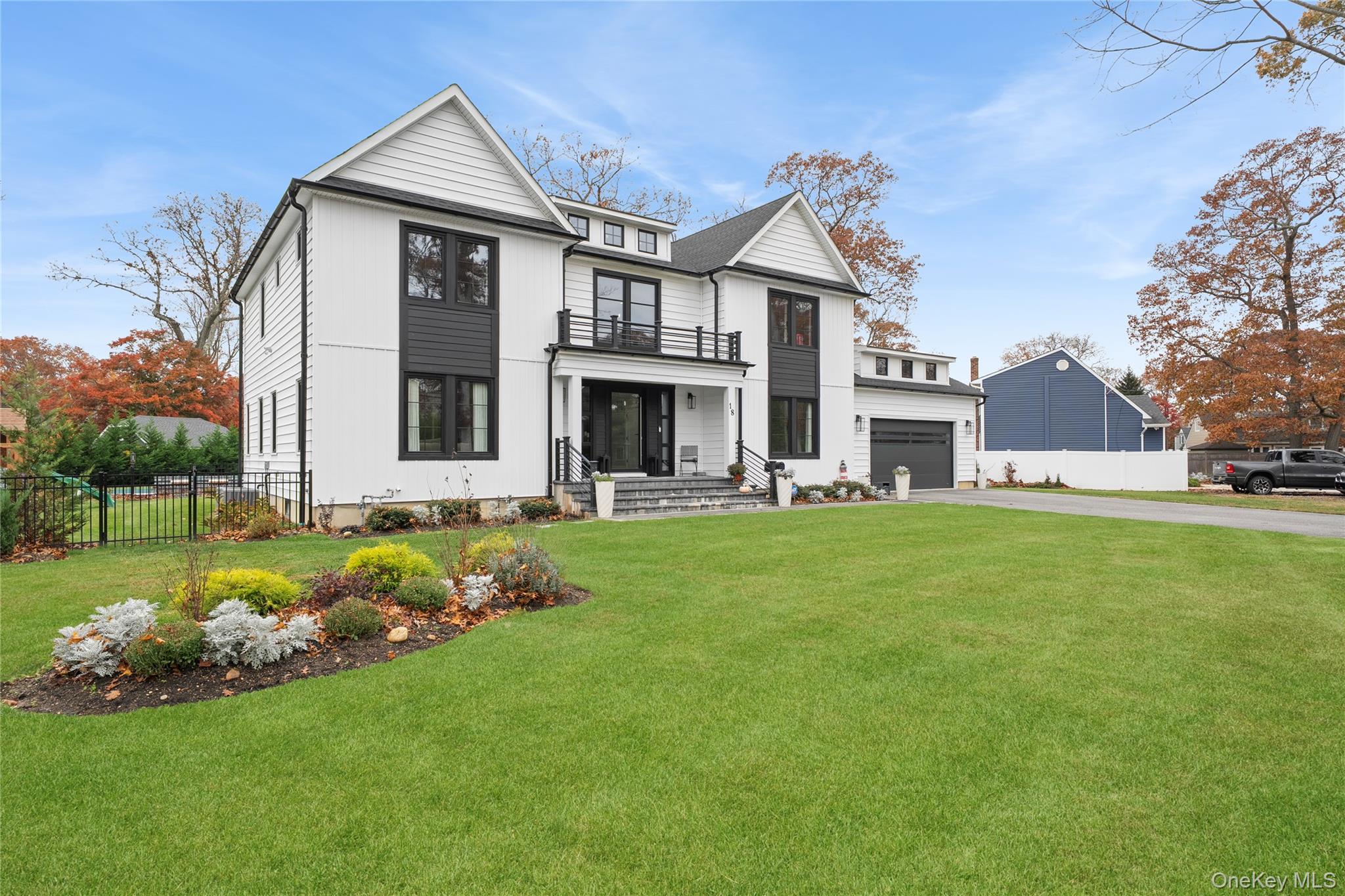 18 Timber Point Road East Islip, NY 11730 - Photo 29 of 34 a front view of house with yard and green space