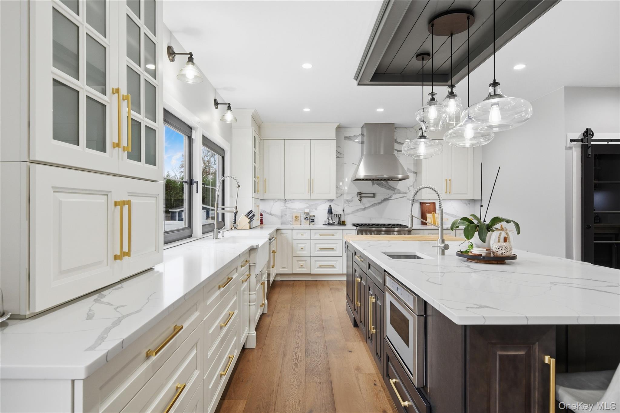 18 Timber Point Road East Islip, NY 11730 - Photo 3 of 34 a kitchen with kitchen island granite countertop lots of counter top space and stainless steel appliances