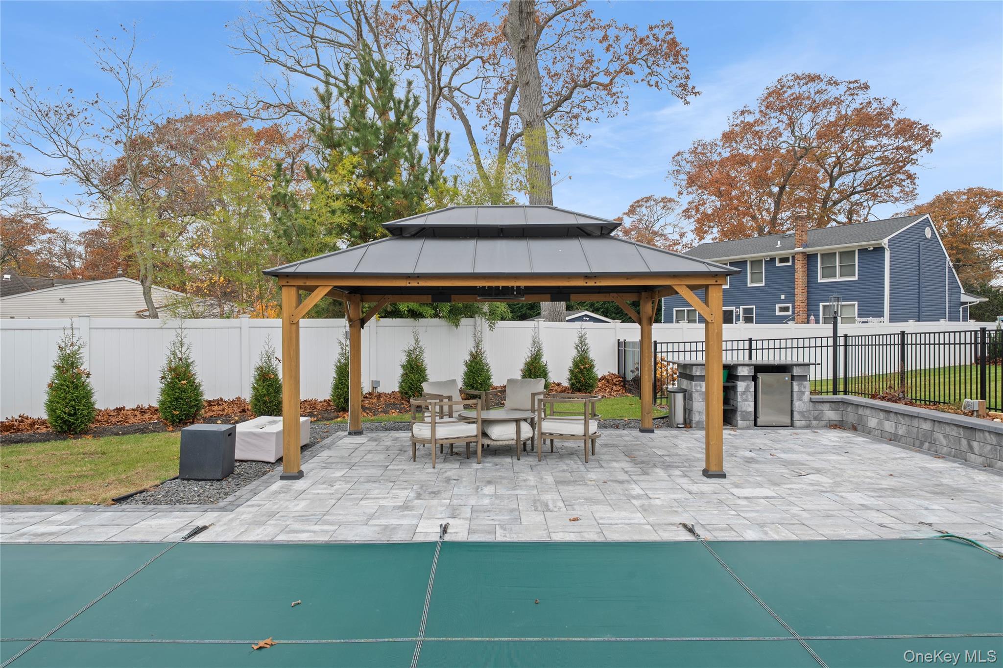 18 Timber Point Road East Islip, NY 11730 - Photo 32 of 34 a view of outdoor space yard deck patio and fire pit