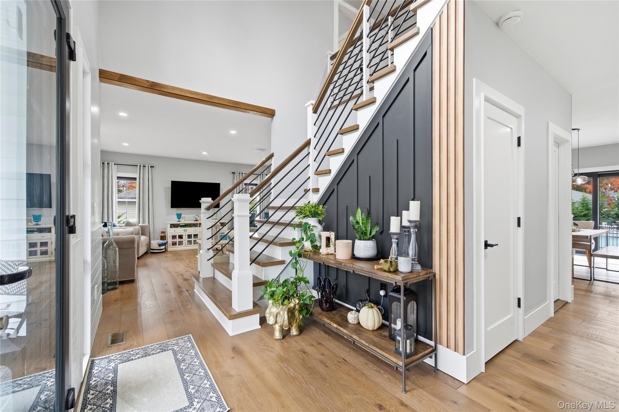 18 Timber Point Road East Islip, NY 11730 - Photo 4 of 34 a view of an entryway with wooden floor and windows