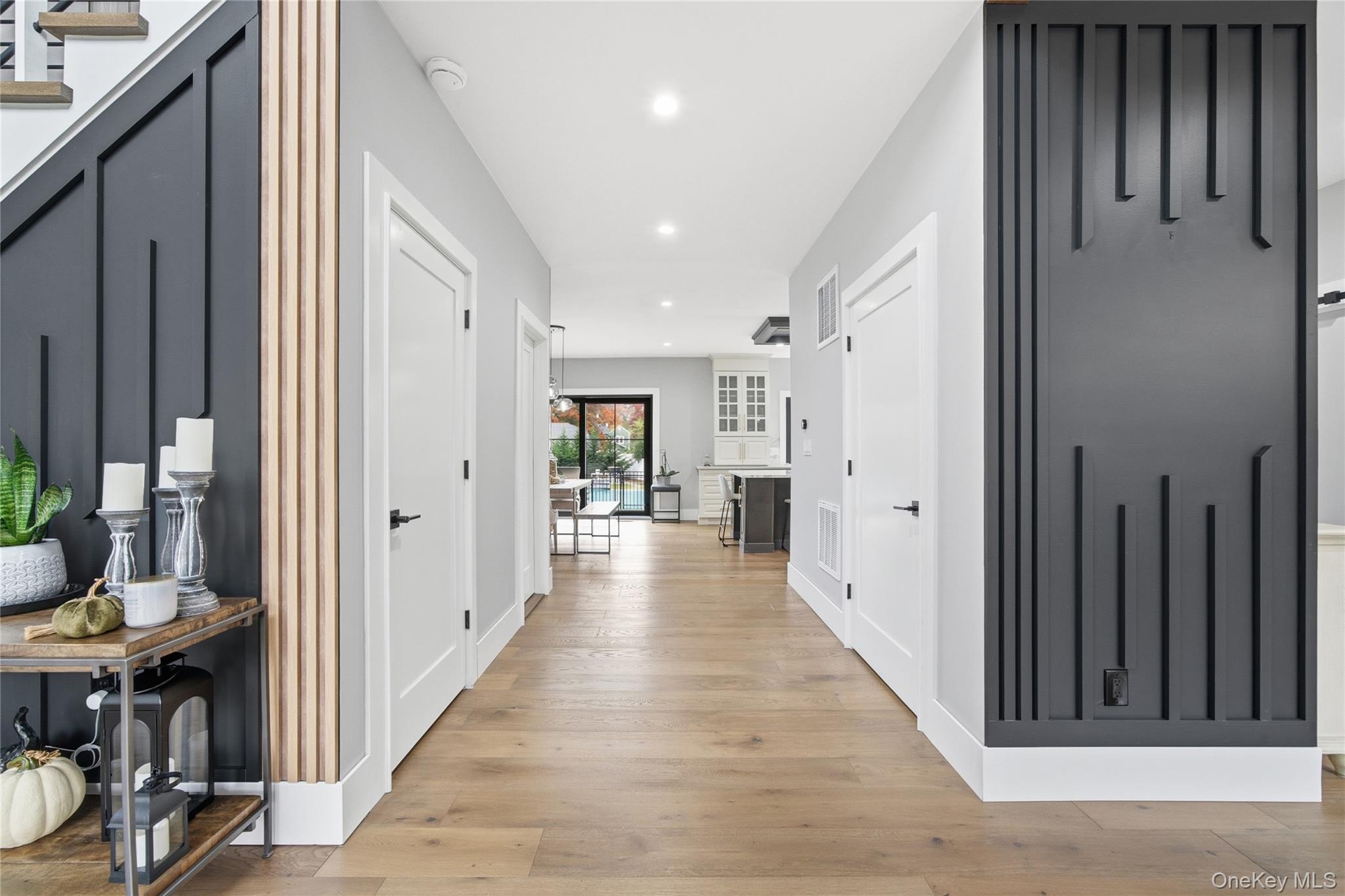 18 Timber Point Road East Islip, NY 11730 - Photo 6 of 34 a view of a hallway with wooden floor and windows
