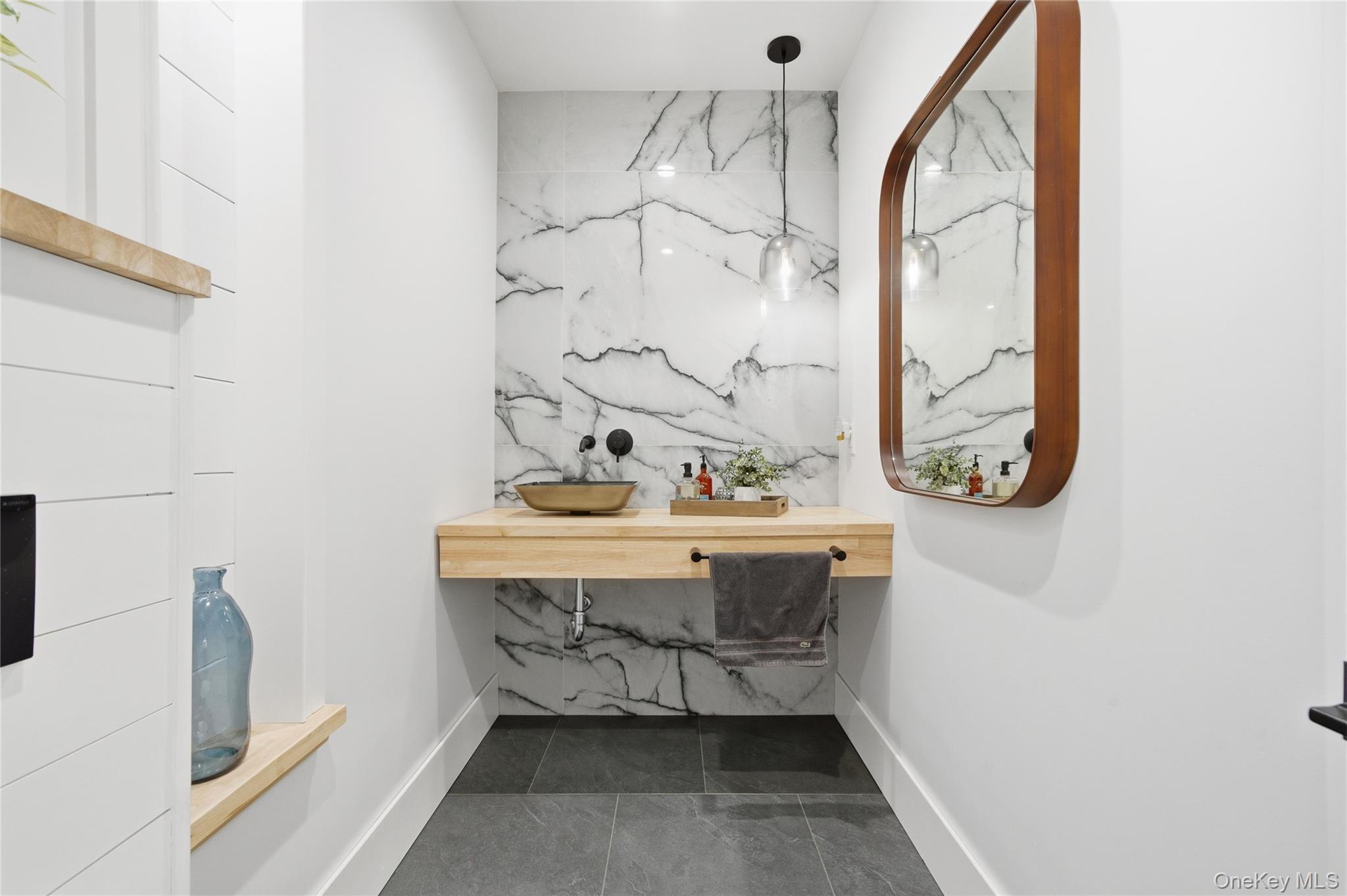 18 Timber Point Road East Islip, NY 11730 - Photo 7 of 34 a bathroom with a sink and a mirror