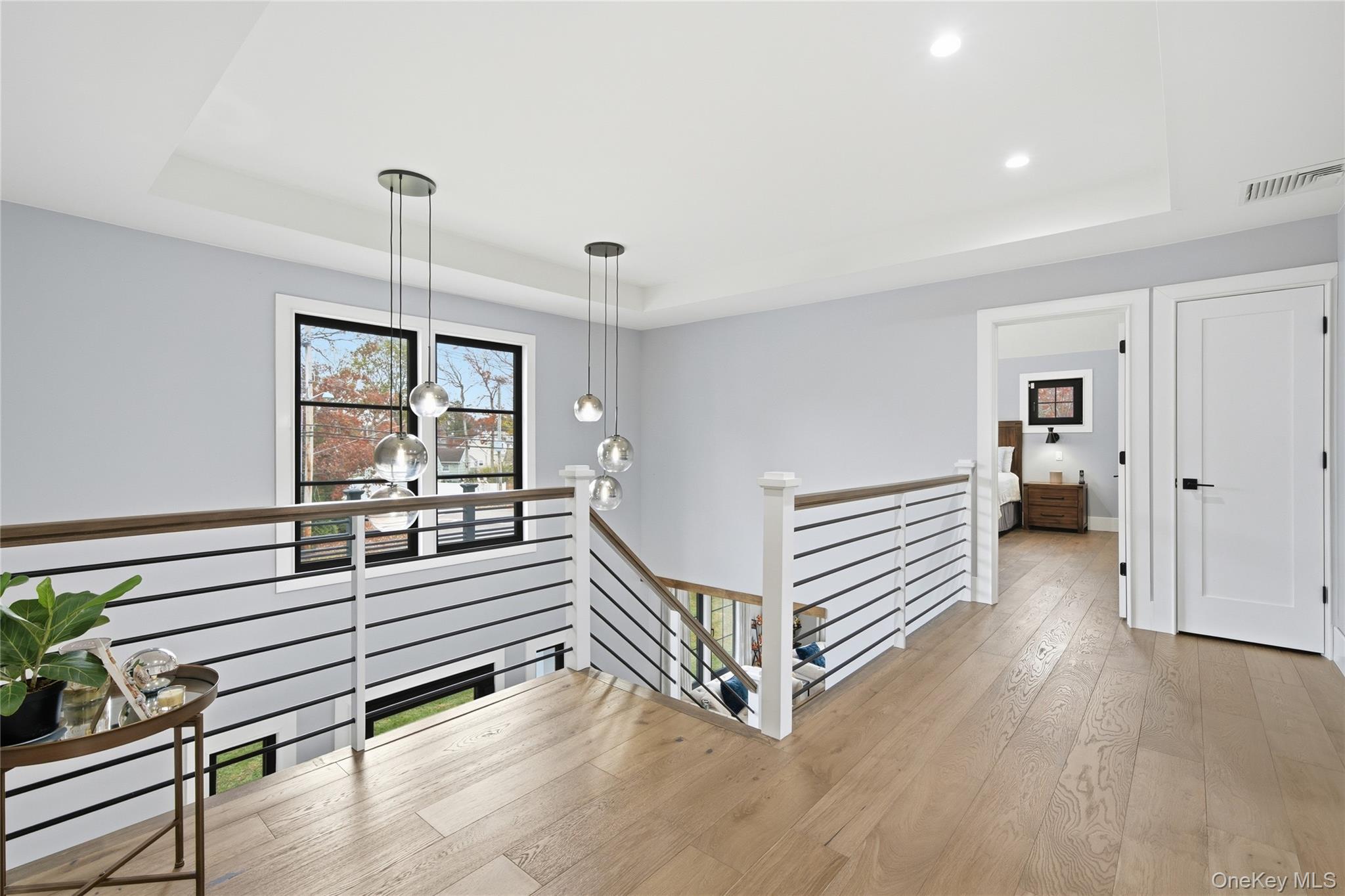 18 Timber Point Road East Islip, NY 11730 - Photo 8 of 34 a view of a room with stairs and a ceiling fan