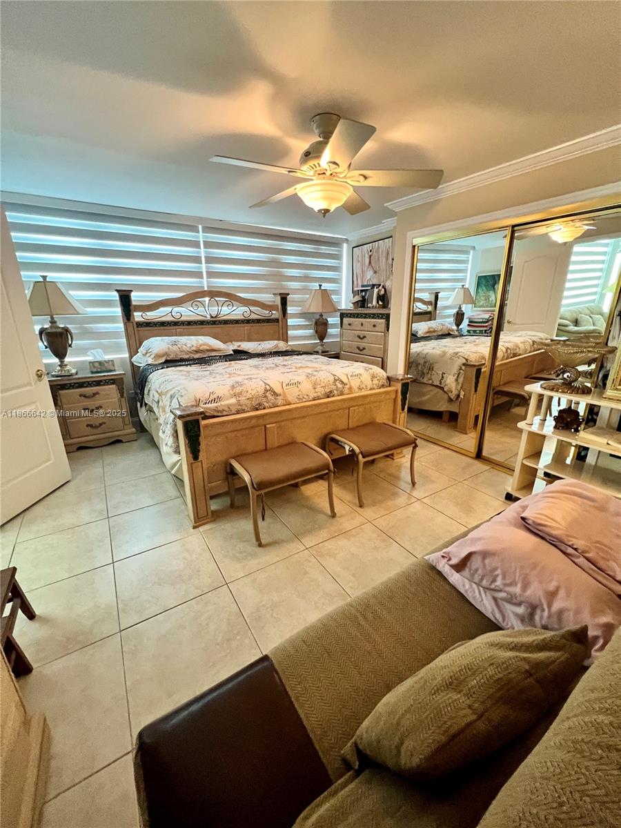 7135 Collins Avenue, Unit 1523 Miami Beach, FL 33141 - Photo 24 of 55 a bedroom with furniture and a large window