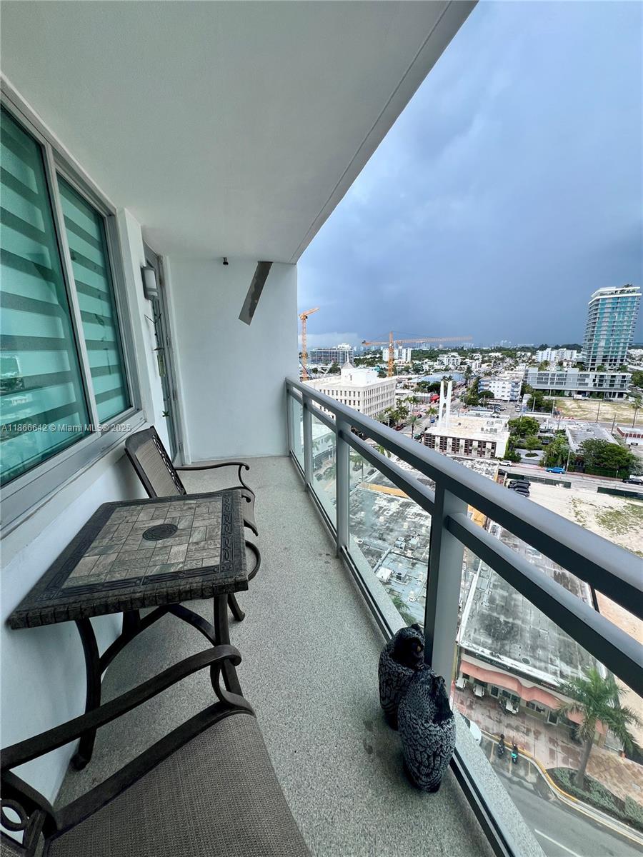 7135 Collins Avenue, Unit 1523 Miami Beach, FL 33141 - Photo 28 of 55 a view of a balcony with chairs