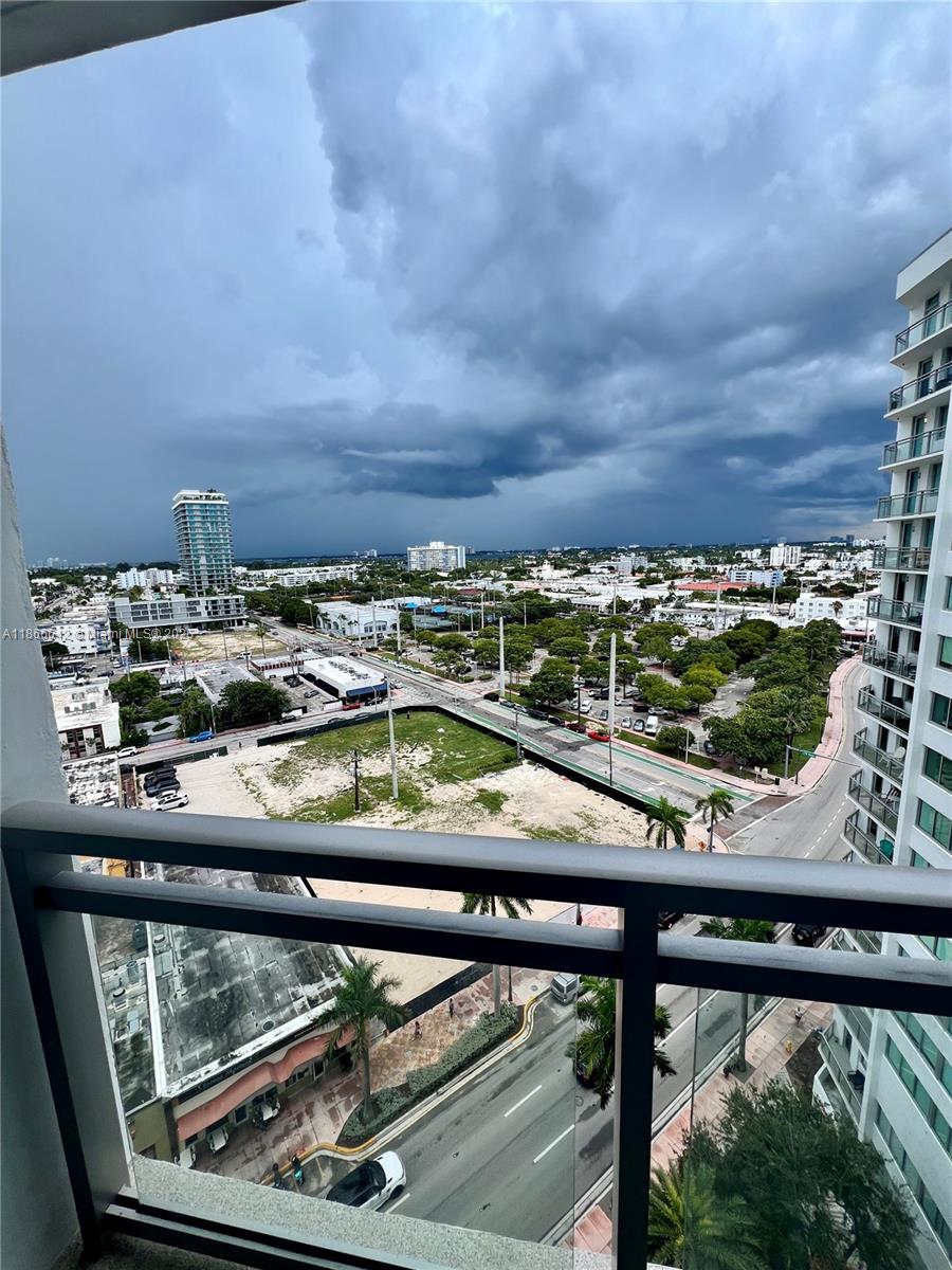 7135 Collins Avenue, Unit 1523 Miami Beach, FL 33141 - Photo 30 of 55 a view of swimming pool from a balcony