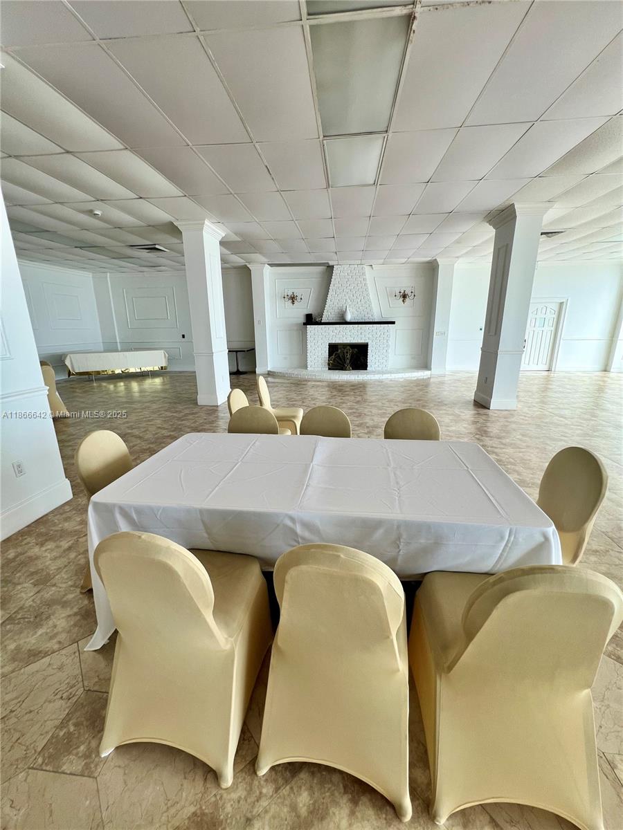 7135 Collins Avenue, Unit 1523 Miami Beach, FL 33141 - Photo 48 of 55 a view of a dining room with furniture