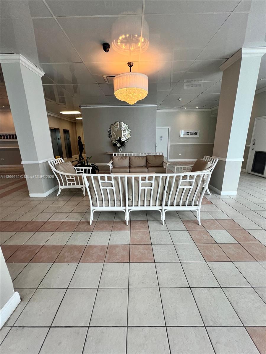 7135 Collins Avenue, Unit 1523 Miami Beach, FL 33141 - Photo 49 of 55 a view of a chairs and table in a patio