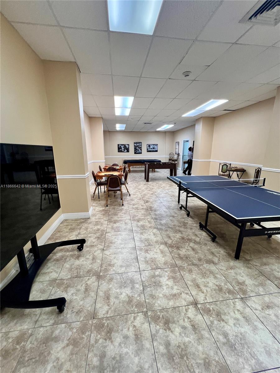 7135 Collins Avenue, Unit 1523 Miami Beach, FL 33141 - Photo 52 of 55 a outdoor space with lots of furniture and a projector