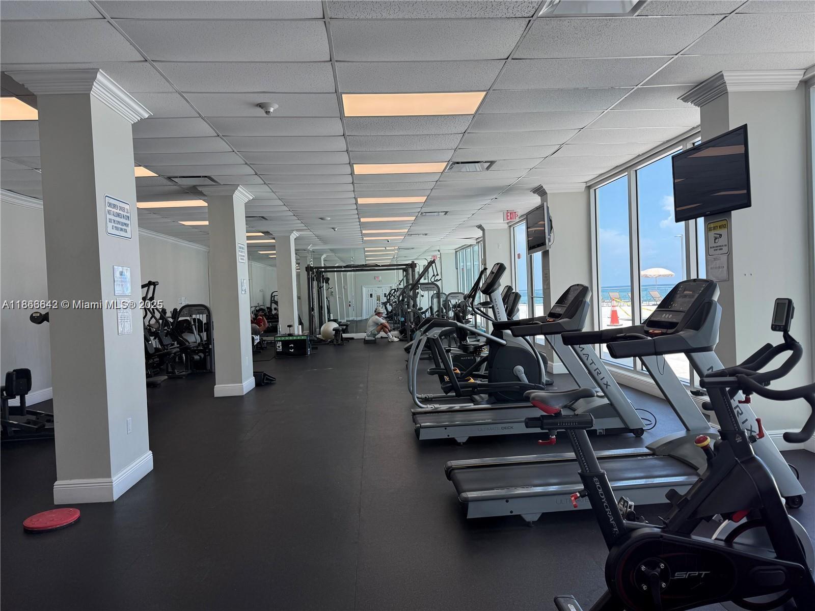 7135 Collins Avenue, Unit 1523 Miami Beach, FL 33141 - Photo 9 of 55 a view of a room with gym equipment