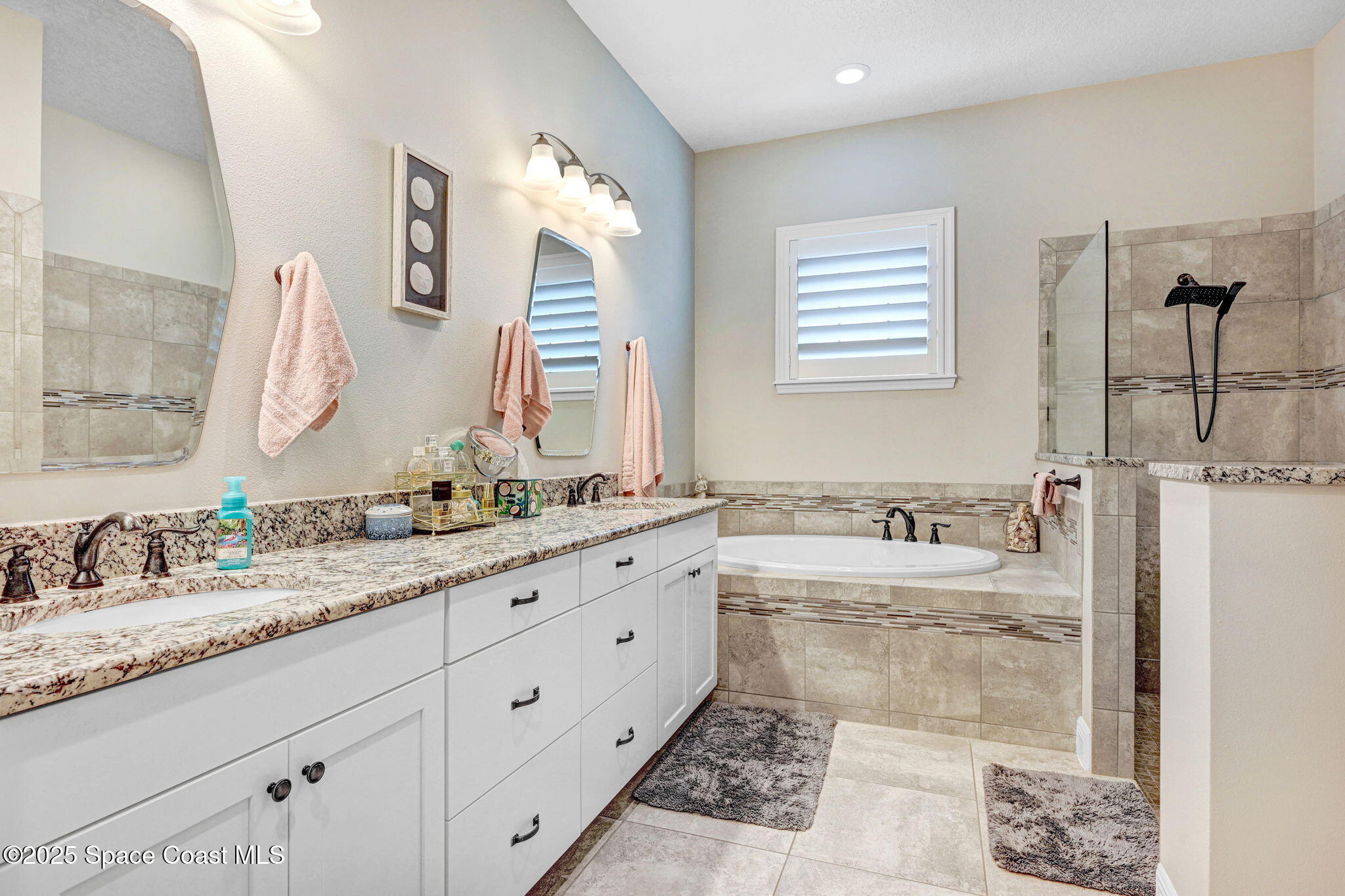 7072 Mercado Lane Melbourne, FL 32940 - Photo 12 of 32 a bathroom with a granite countertop sink mirror and a