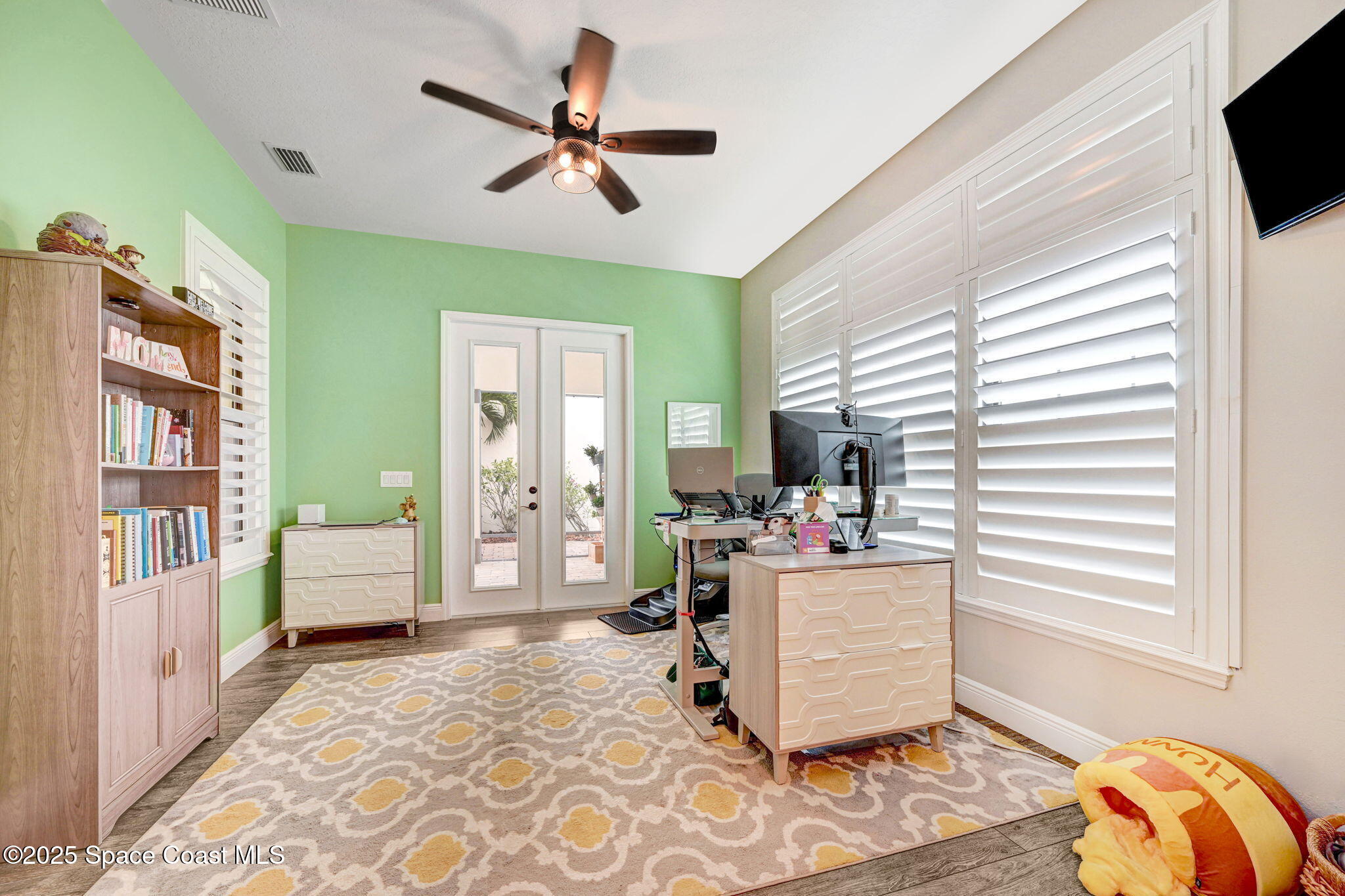 7072 Mercado Lane Melbourne, FL 32940 - Photo 14 of 32 a living room with furniture and a window