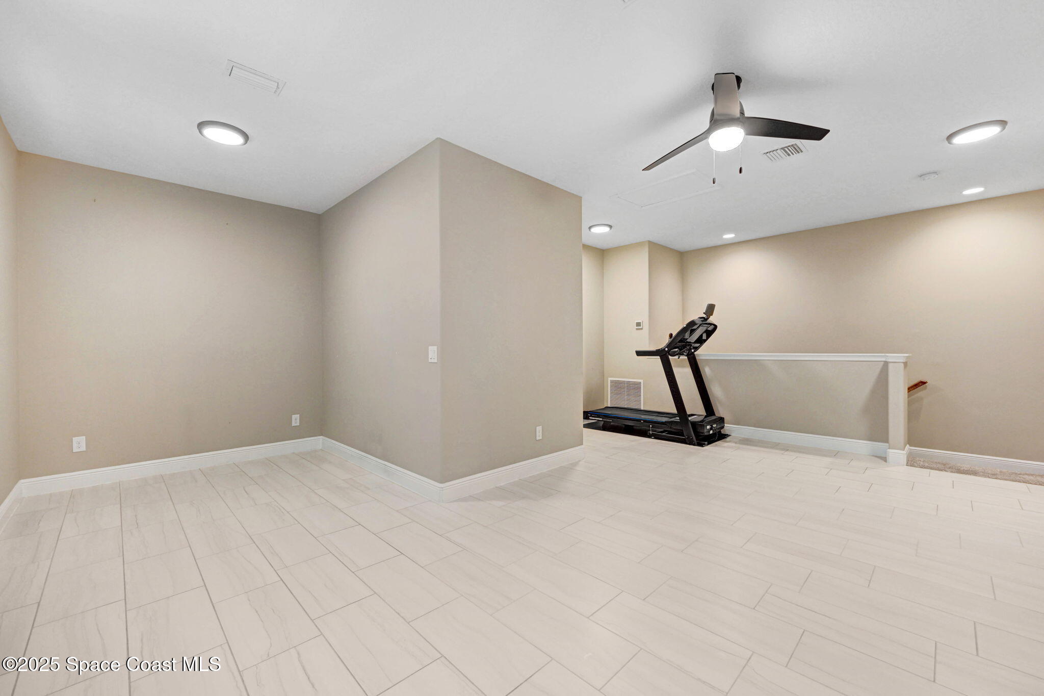 7072 Mercado Lane Melbourne, FL 32940 - Photo 17 of 32 a view of a room with gym equipment