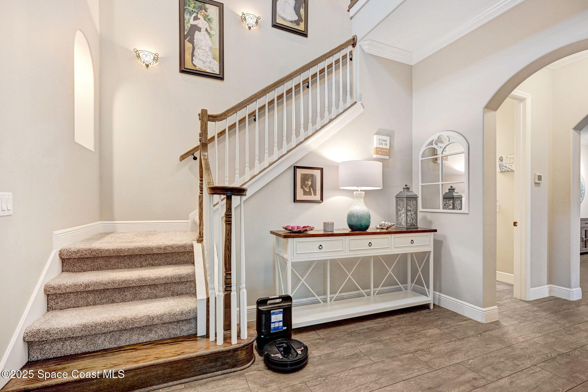 7072 Mercado Lane Melbourne, FL 32940 - Photo 18 of 32 a view of entryway livingroom and hall with wooden floor