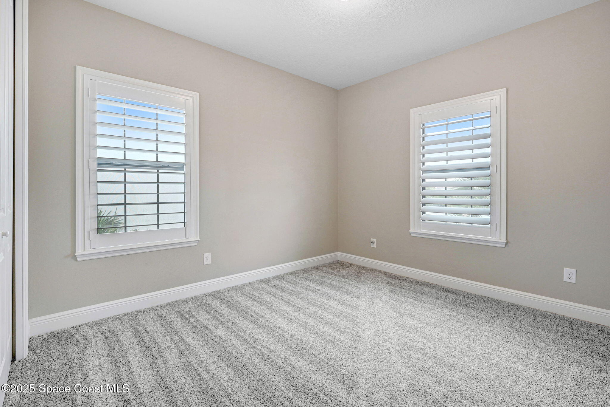 7072 Mercado Lane Melbourne, FL 32940 - Photo 23 of 32 a view of an empty room with a window