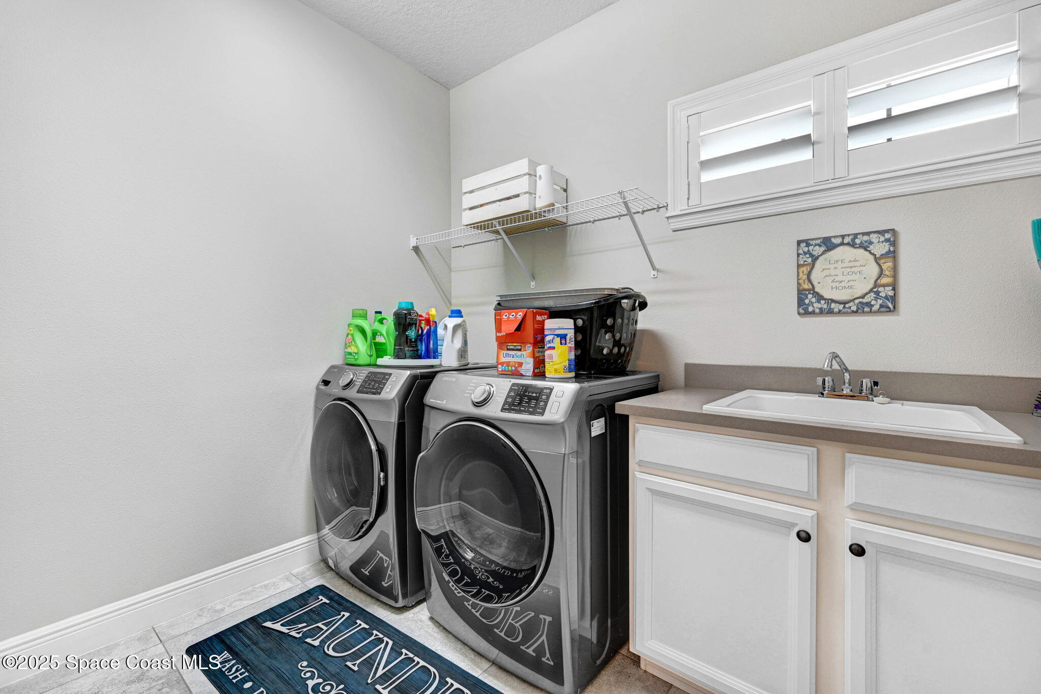 7072 Mercado Lane Melbourne, FL 32940 - Photo 26 of 32 a utility room with dryer and washer
